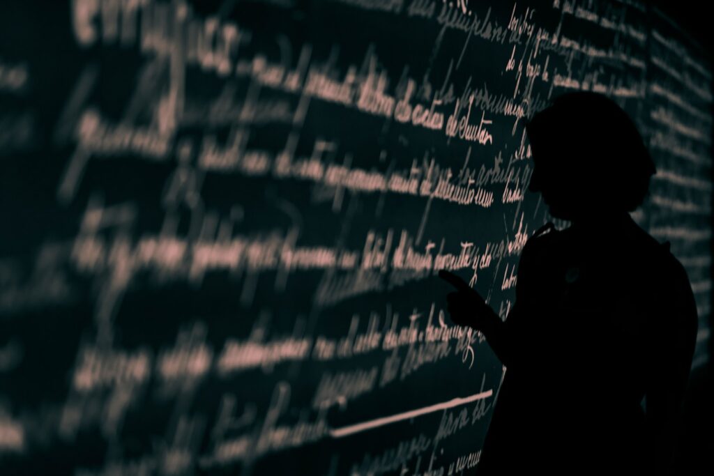 silhouette on person writing